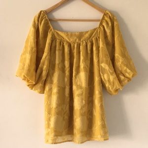 Puff sleeve blouse with floral appliqués